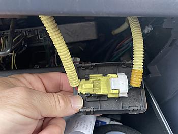 I found the wire to the airbag and disconnected it here